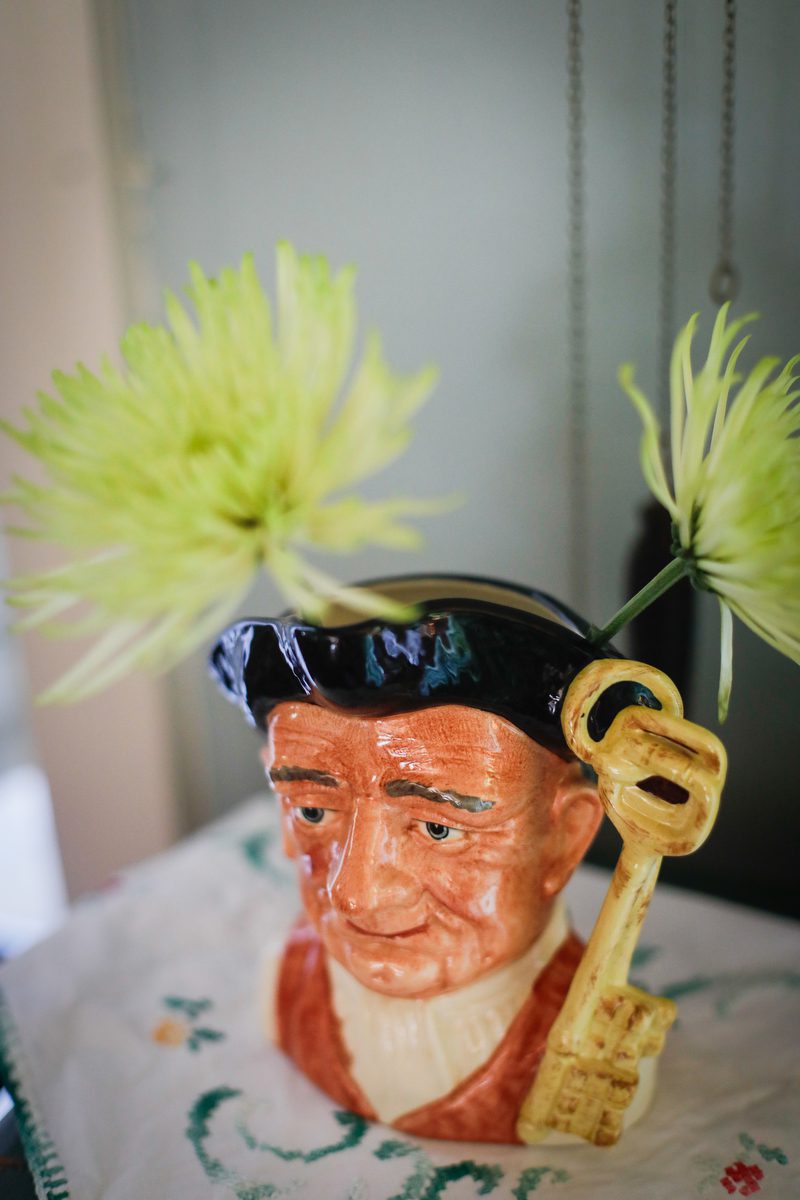 A picture of a vase with a face.