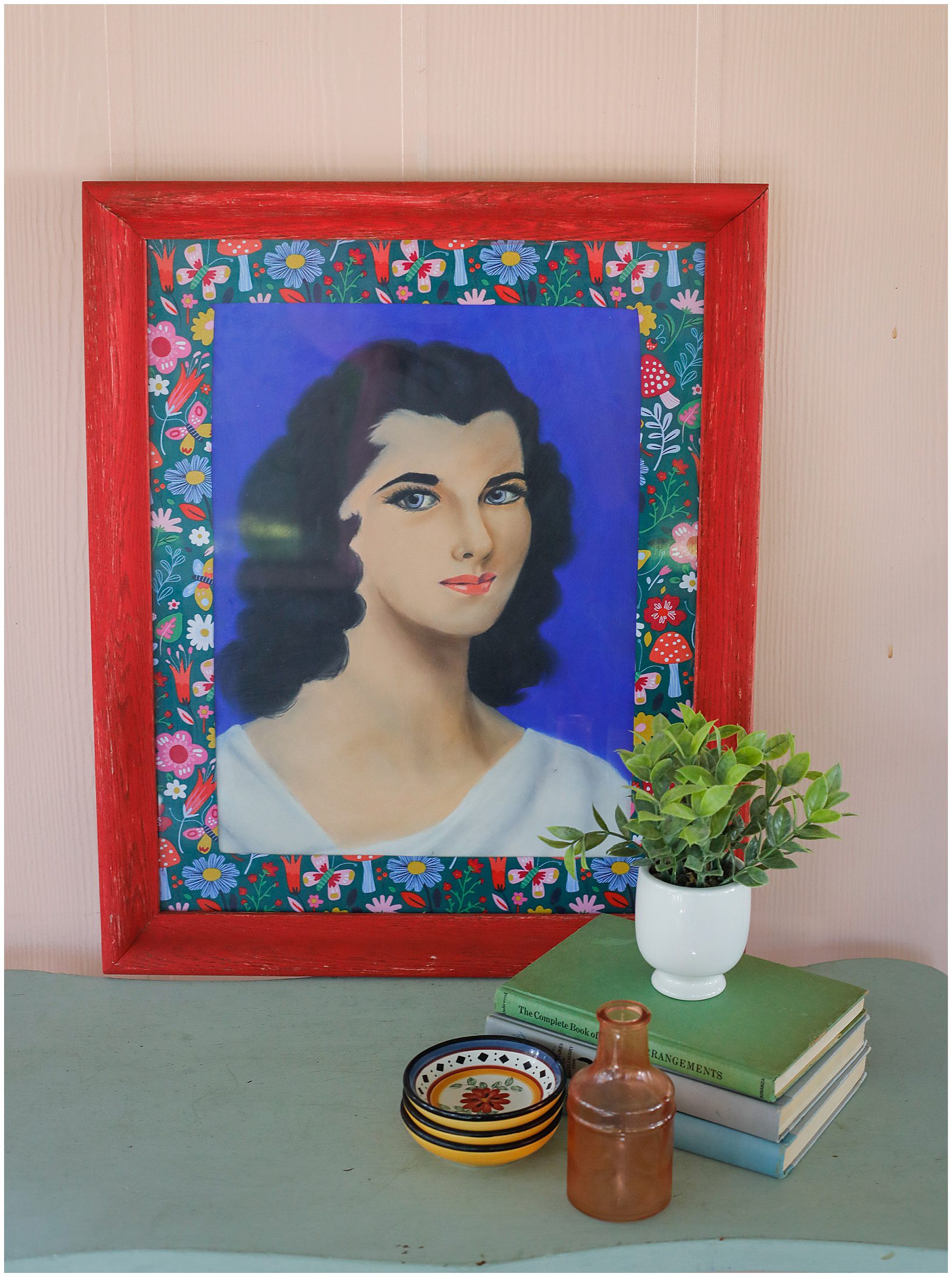 a picture of a woman in a red frame