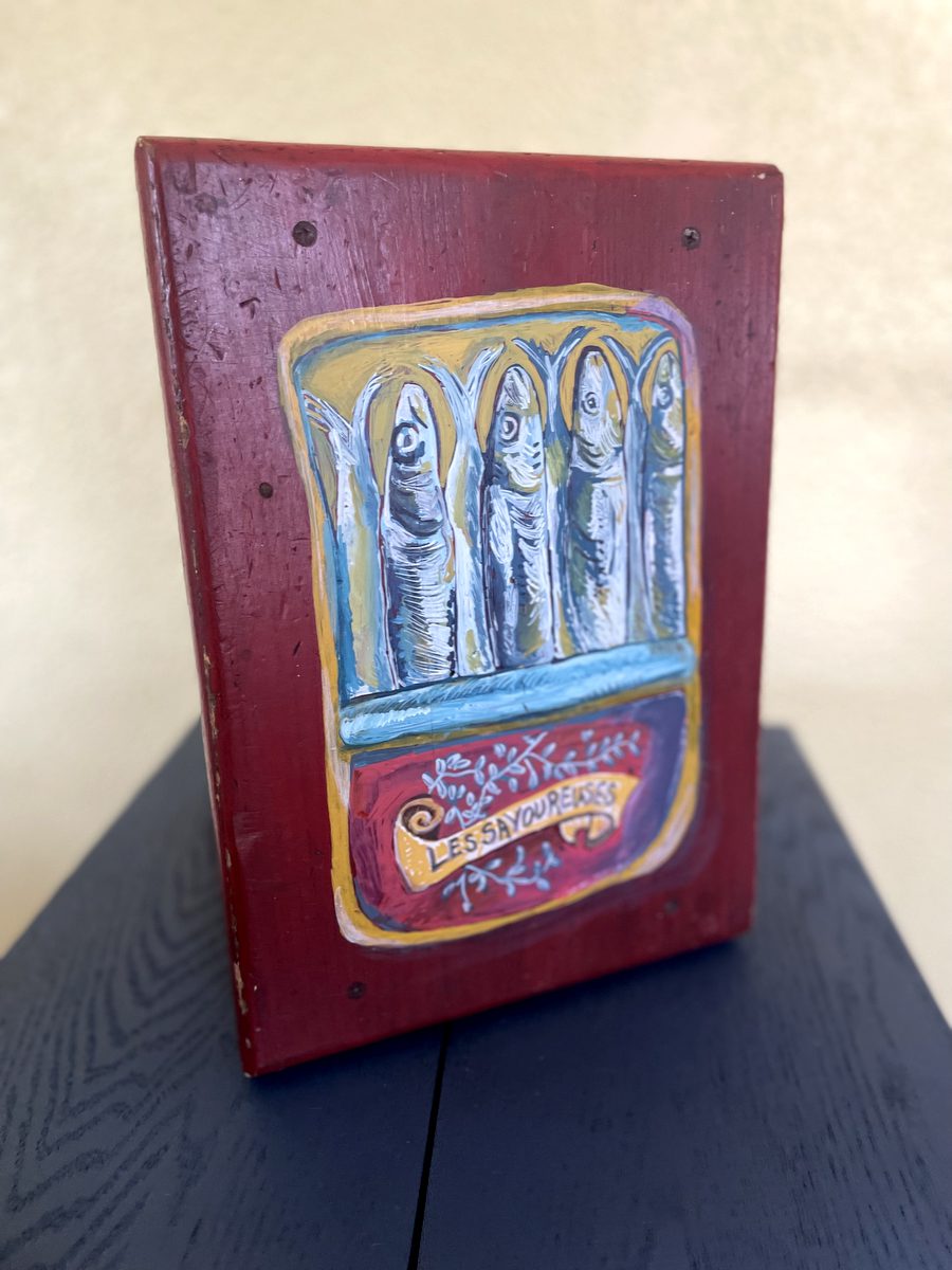 sardines painted on a red footstool.